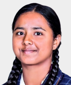 Portrait of a young girl with two braids wearing a blue plaid school uniform, smiling softly at the camera.